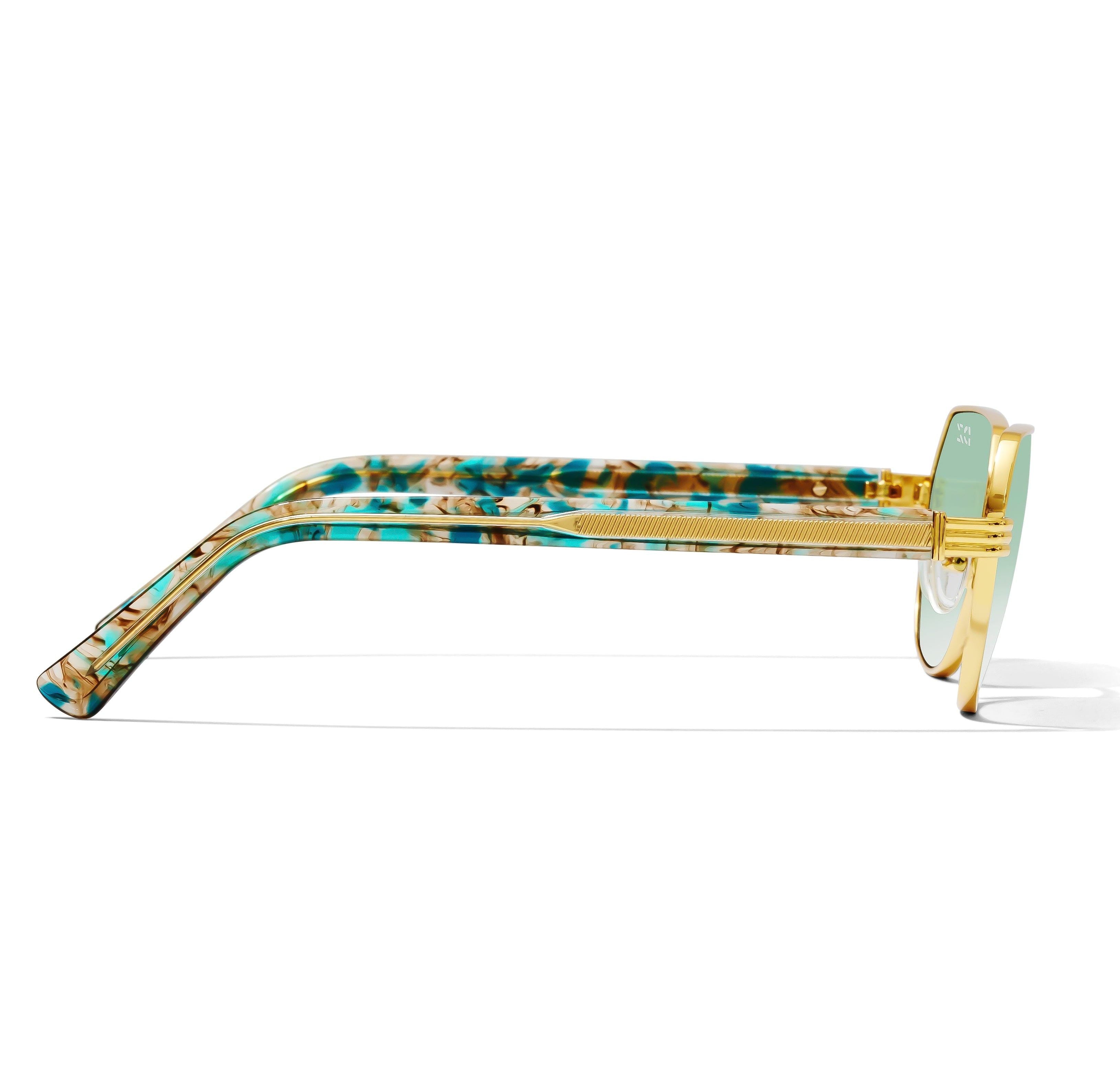 Sunglasses with a gold frame and multicolored arm on a white background