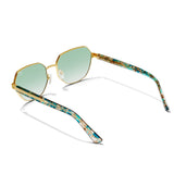 Sunglasses with gold frame and green-tinted lenses on a white background