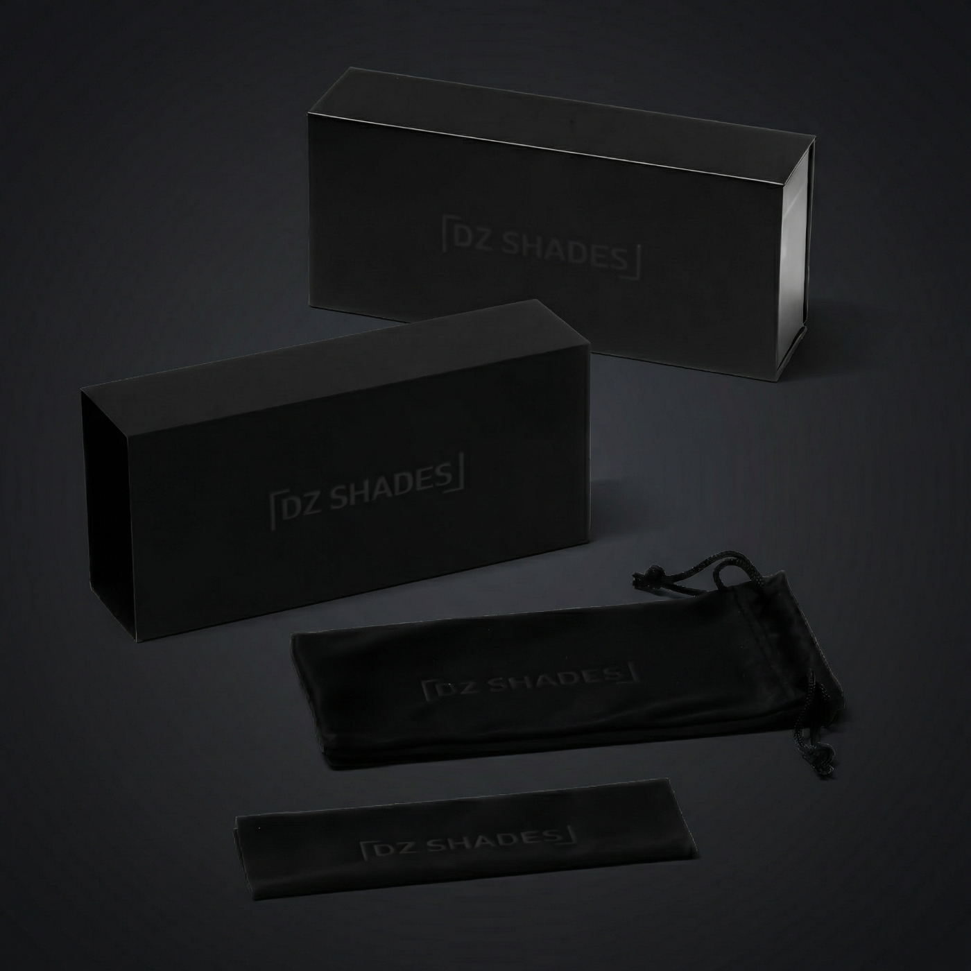 Black 'DZ Shades' packaging set on a dark background